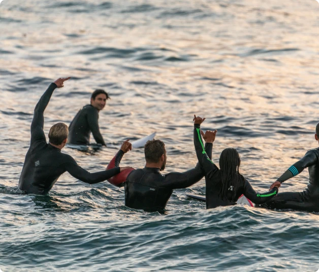 Group of students at the sea during surf lessons at Sagres Sun Stay